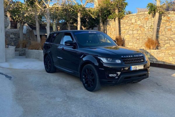 The front seats and the steering wheel of a luxury Range Rover.